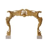 A 20TH CENTURY GILTWOOD AND GESSO FIRE SURROUND IN THE ROCOCO TASTE