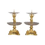 A PAIR OF EARLY 20TH CENTURY GILT BRONZE AND CUT GLASS TWO-TIER SURTOUT DE TABLE OR TABLE