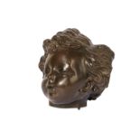 A LATE 18TH CENTURY BRONZE MODEL OF A CHILD'S HEAD IN THE MANNER OF JEAN-BAPTISTE PIGALLE