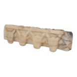 A SOUTH ARABIAN ALABASTER FRAGMENT, CIRCA 1ST CENTURY B.C. - 1ST CENTURY A.D.