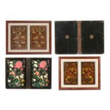 THREE PAIRS OF LACQUERED PAPIER-MÂCHÉ BOOK BINDINGS WITH FLORAL MOTIVES