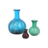 THREE CLEAR COLOURED BLOWN MUGHAL GLASS BOTTLES