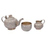 A THREE-PIECE INDIAN SILVER TEA SET