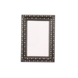 λ AN INDIAN IVORY AND EBONY PICTURE FRAME