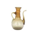 A CLEAR AMBER-COLOURED MUGHAL GLASS EWER