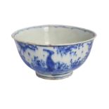 A SMALL BLUE AND WHITE POTTERY RICE BOWL