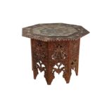 A KASHMIRI CARVED HARDWOOD FOLDABLE OCCASIONAL TABLE