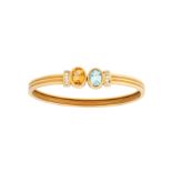 A citrine, blue topaz and diamond bangle