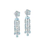 A pair of blue topaz and diamond pendent earrings