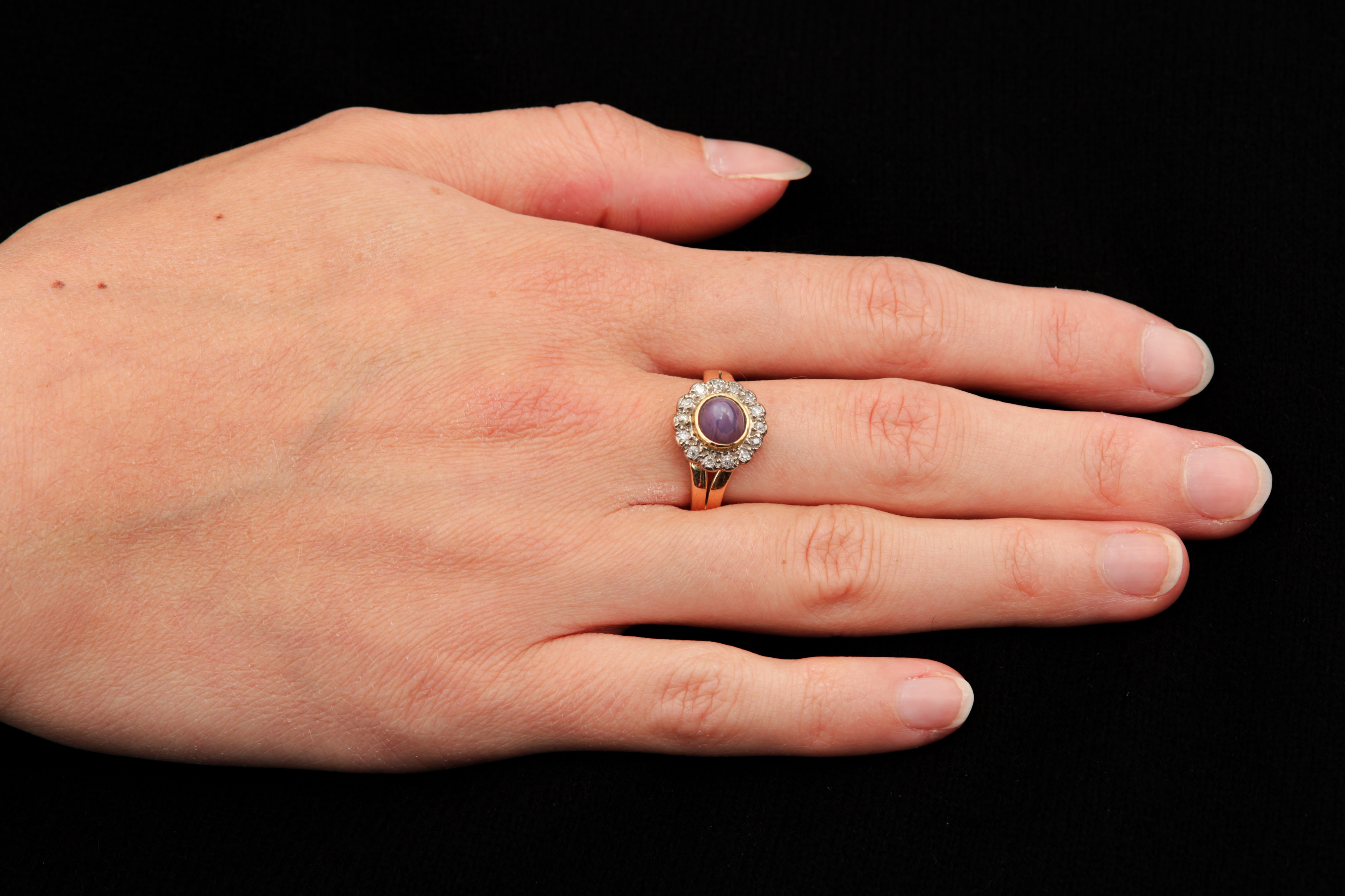 A purple star sapphire and diamond cluster ring, 1964 - Image 2 of 2