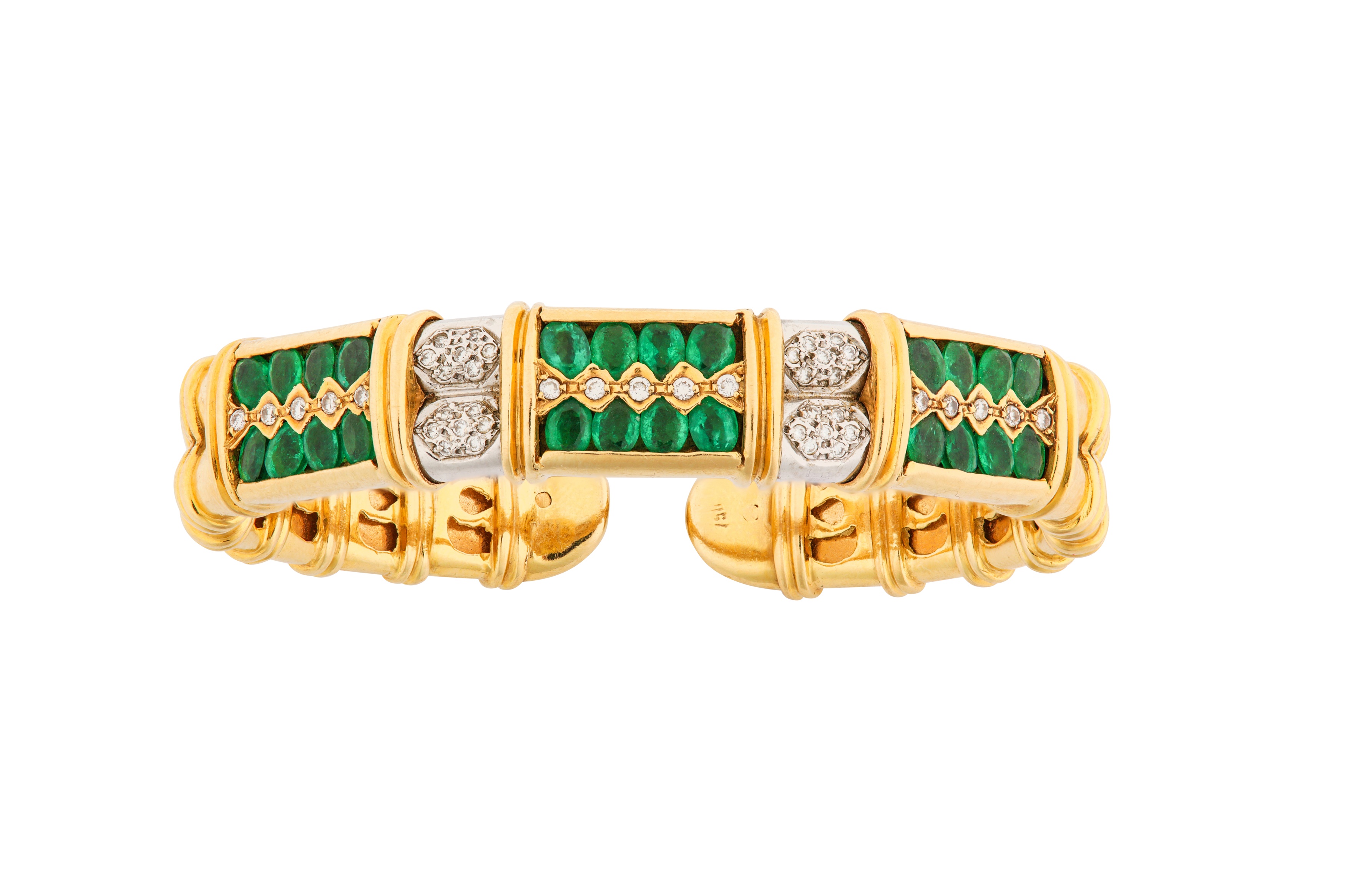 An emerald and diamond bangle, earrings, and ring suite