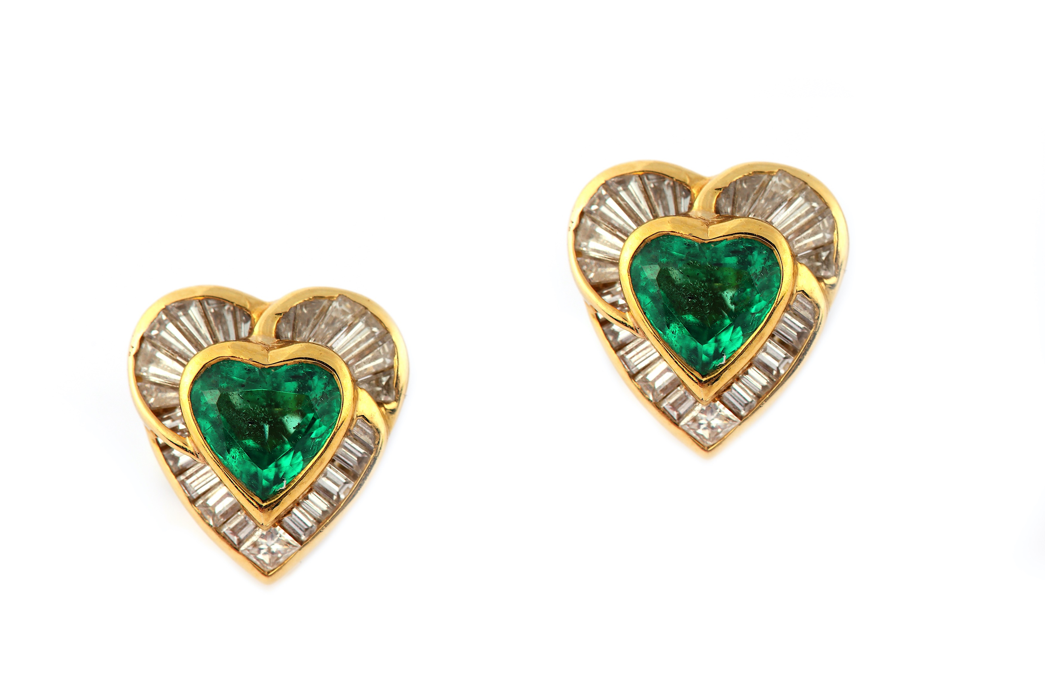 A pair of emerald and diamond earclips, by H. Stern