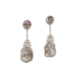 A pair of diamond pendent earrings