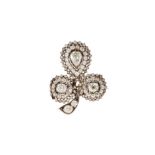 A diamond clover brooch