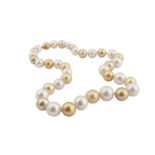 A cultured pearl necklace with a diamond-set clasp