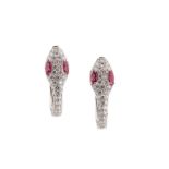 A pair of ruby and diamond snake earrings