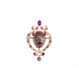 An amethyst and gem-set brooch / pendant, circa 1925