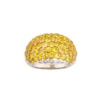 A yellow sapphire and diamond dress ring