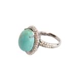 A turquoise and diamond ring