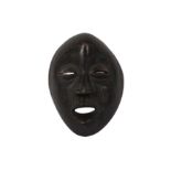 AN AFRICAN TRIBAL DAN MASK