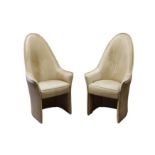 A PAIR OF UNUSUAL HIGHBACKED LEATHER TUB ARMCHAIRS