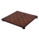 AN EARLY 19TH CENTURY MAHOGANY AND ROSEWOOD PARQUETRY CHESS BOARD