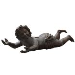 A LARGE CARVED WOODEN CHERUB FIGURE