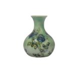 WILLIAM MOORCROFT FOR LIBERTY & CO., a Tudor Rose miniature bottle vase