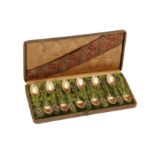 A cased set of twelve late 19th century French 950 standard parcel gilt silver teaspoons, Paris