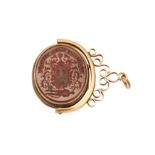 A Victorian mid-19th century unmarked gold combination swivel seal and locket, circa 1860