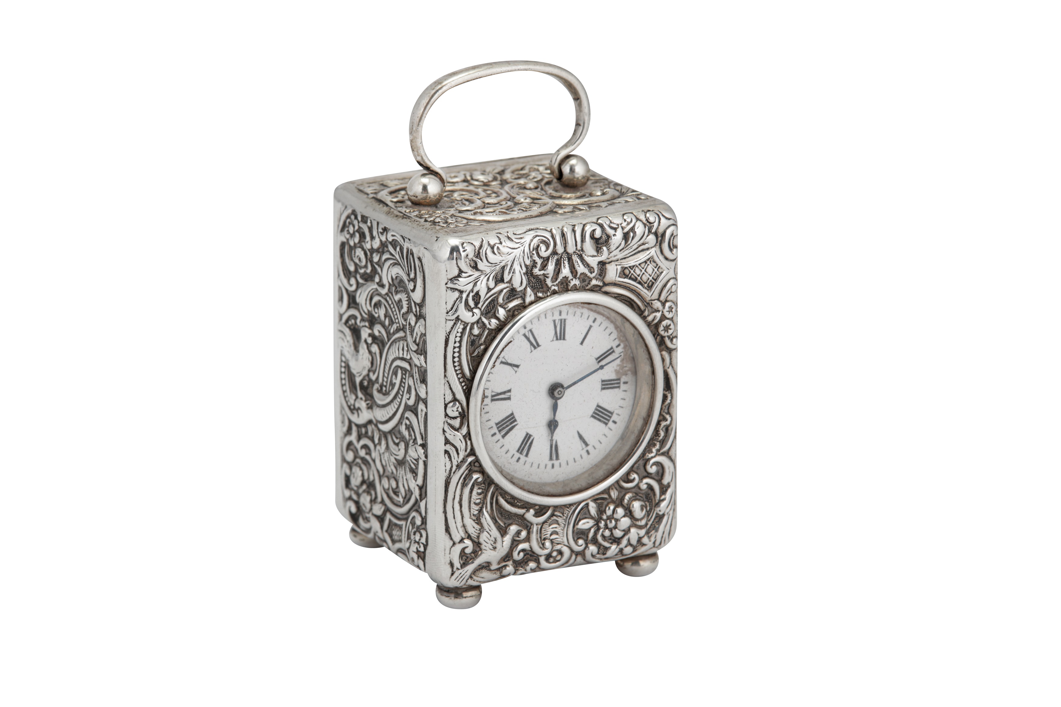 An Edwardian sterling silver cased travelling timepiece carriage clock, London 1905 by William