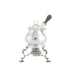 A George III sterling silver brandy pan and cover on burner stand, London 1767 by William Grundy