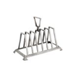 A Victorian sterling silver seven bar toast rack, Sheffield 1893 by Walker and Hall