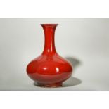 A CHINESE COPPER RED-GLAZED BOTTLE VASE.