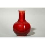 A CHINESE COPPER RED-GLAZED VASE.