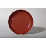 A CHINESE COPPER RED-GLAZED DISH.