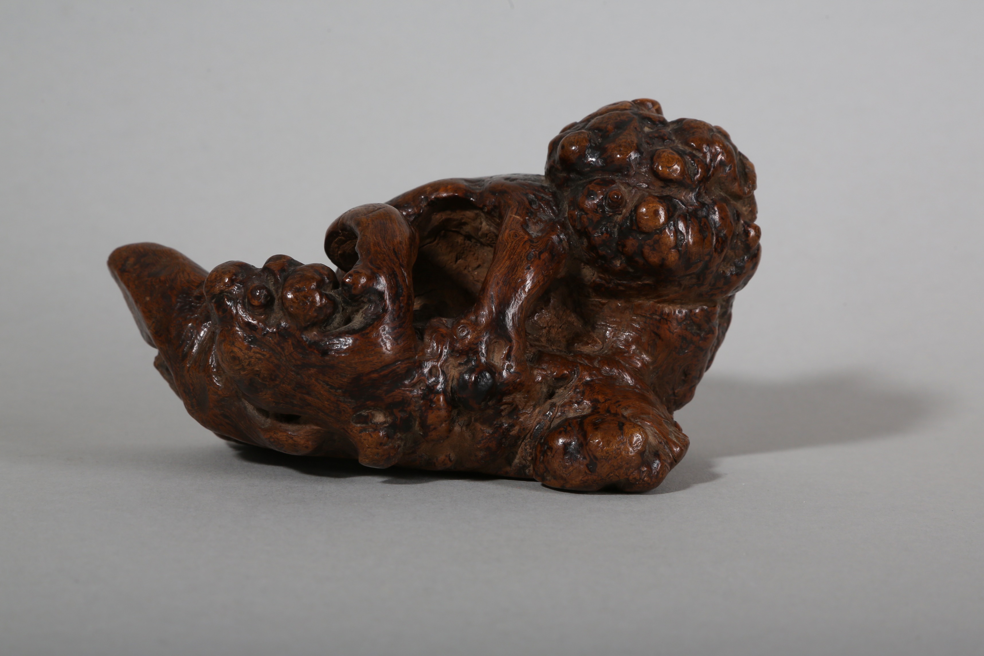 A CHINESE ROOT WOOD 'LION AND CUB' CARVING.