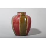 A CHINESE COPPER RED AND OLIVE GREEN-GLAZED JAR.