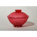 A CHINESE PEKING GLASS RUBY RED TEA BOWL AND COVER.