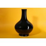 A CHINESE MIRROR BLACK-GLAZED BOTTLE VASE.