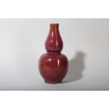 A CHINESE FLAMBÉ GLAZED DOUBLE GOURD VASE.