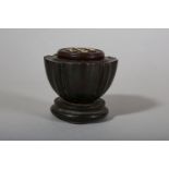 λ A CHINESE CARVED ZITAN WOOD 'LOTUS POD' CRICKET BOX.