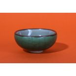 A CHINESE GREEN-GLAZED BOWL.