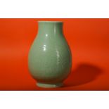 A CHINESE CELADON-GLAZED 'DRAGON' VASE.