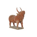 A CHINESE POTTERY MODEL OF A BULL.