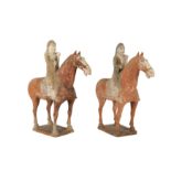 A PAIR OF CHINESE POTTERY RIDERS ON HORSEBACK.