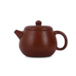 A SMALL CHINESE YIXING ZISHA TEAPOT AND COVER.