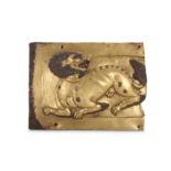 A TIBETAN GILT-COPPER REPOUSSE 'SNOW LION' PLAQUE.