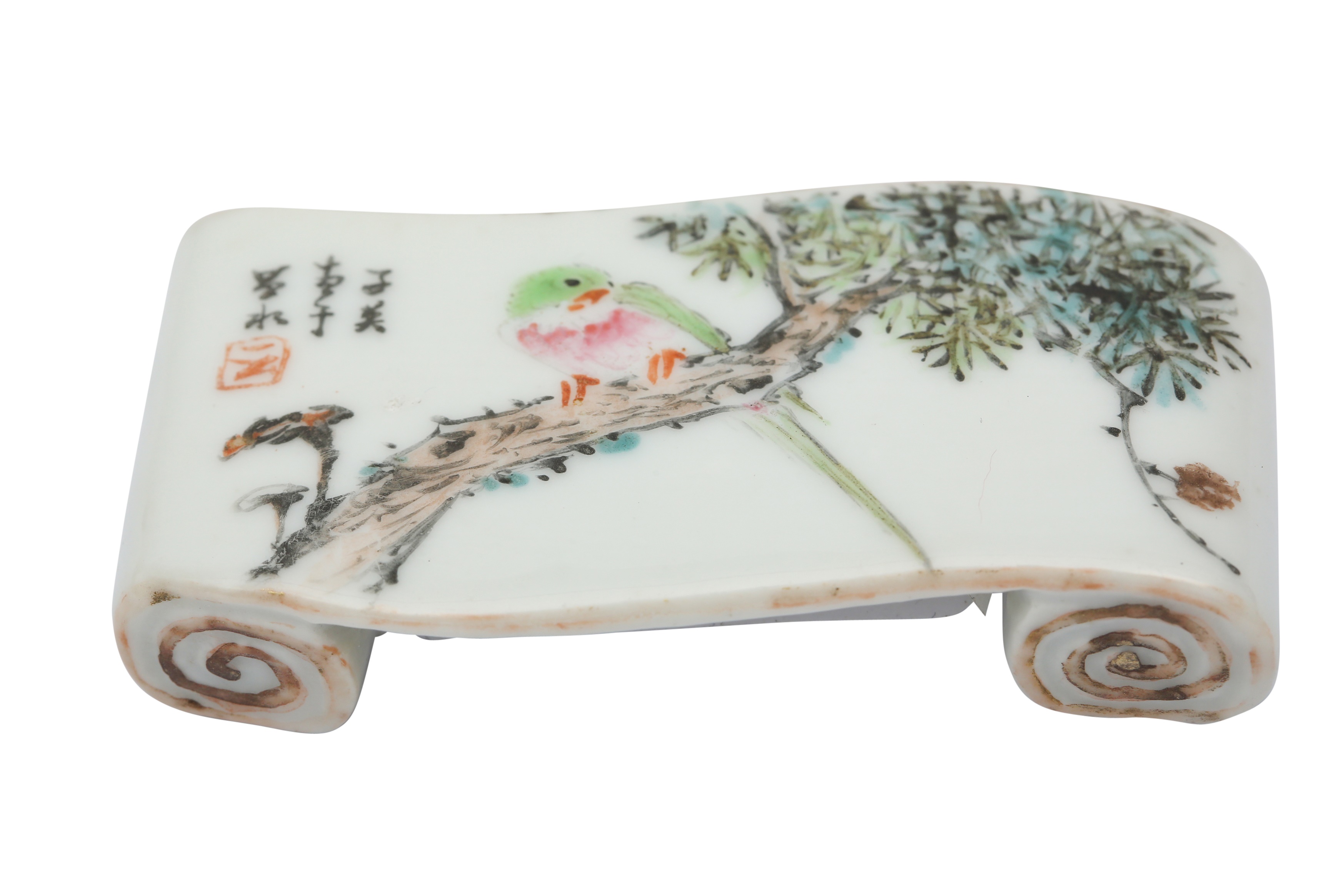 A CHINESE FAMILLE ROSE 'PARROT' BRUSH REST.