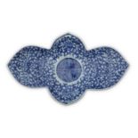 A CHINESE BLUE AND WHITE INGOT-SHAPED SAUCER.